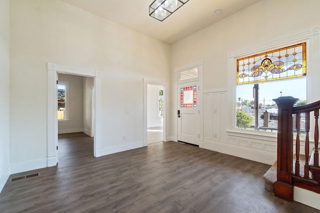 entrance foyer with dark hardwood / wood-style floors