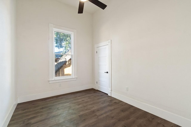 spare room featuring ceiling fan and dark hardwood / wood-style flooring