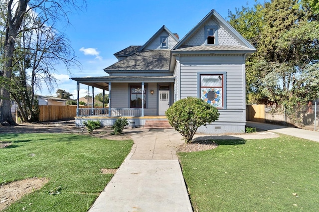 view of front of home with a front yard and a porch