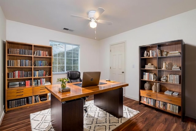 office space with dark wood-type flooring and ceiling fan