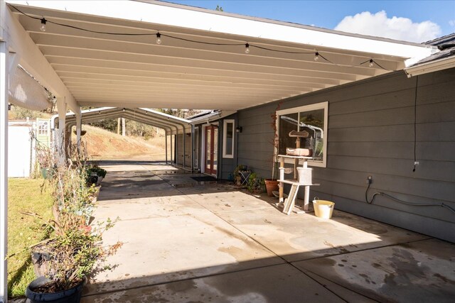 view of patio / terrace with a carport