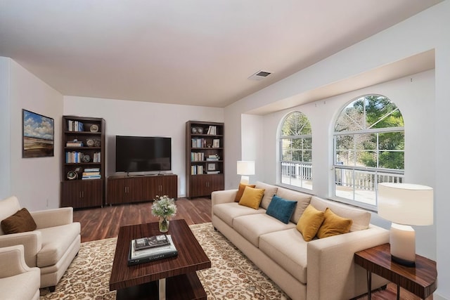 living room featuring dark wood-type flooring