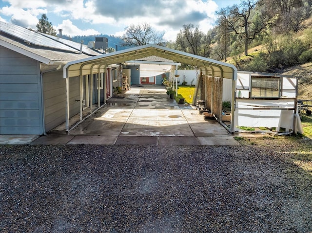 exterior space with a carport