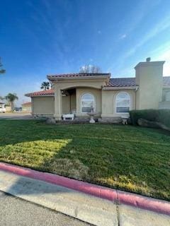 view of front of home with a front lawn