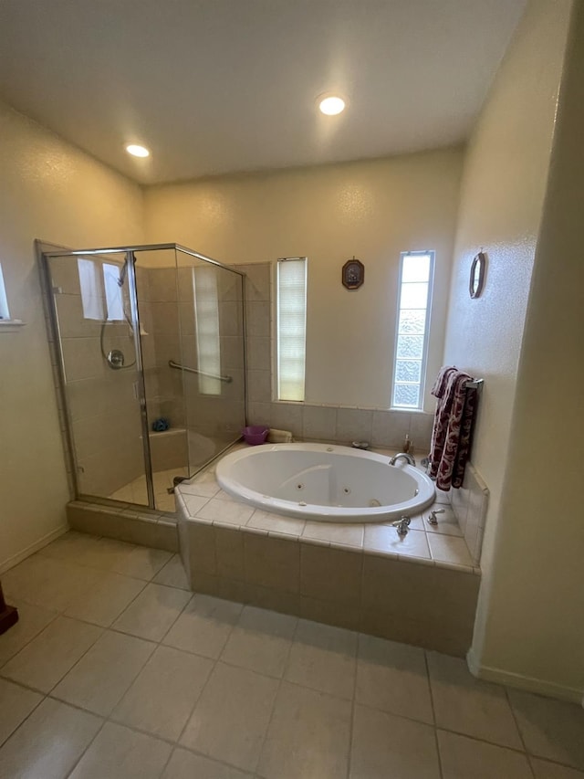 bathroom with tile patterned floors and separate shower and tub