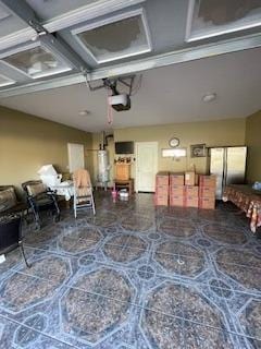 interior space featuring a garage door opener and gas water heater