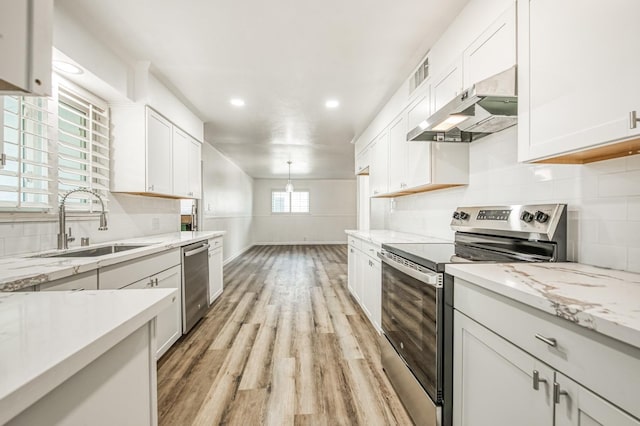 kitchen featuring light hardwood / wood-style flooring, stainless steel appliances, white cabinetry, and sink