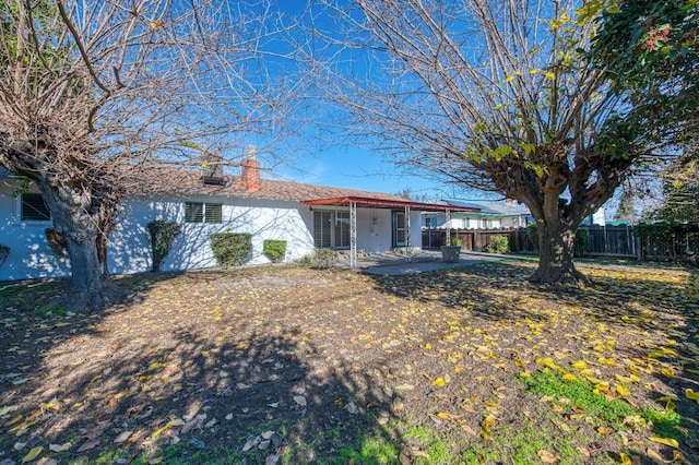 rear view of property featuring a patio