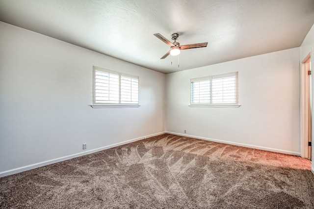 unfurnished room with carpet, plenty of natural light, and ceiling fan