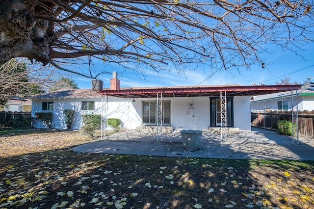 back of property with a patio area