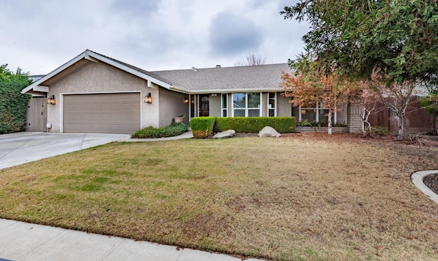 ranch-style house featuring a front yard and a garage