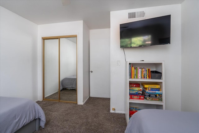 bedroom with a closet and carpet floors