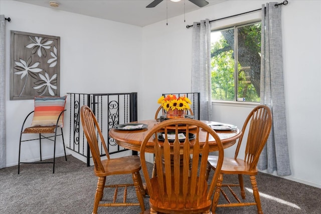 dining room featuring ceiling fan, a healthy amount of sunlight, and carpet floors