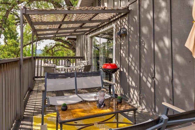 wooden terrace with a grill, a pergola, and a hot tub