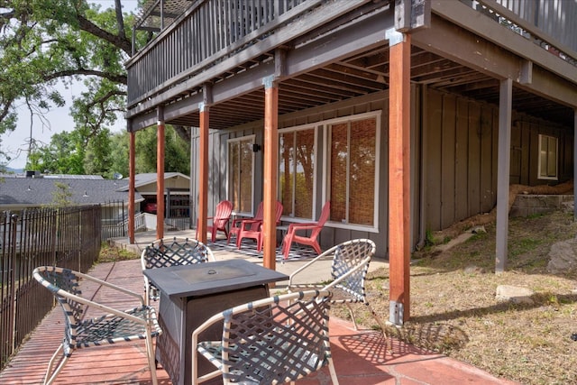 wooden terrace featuring a patio