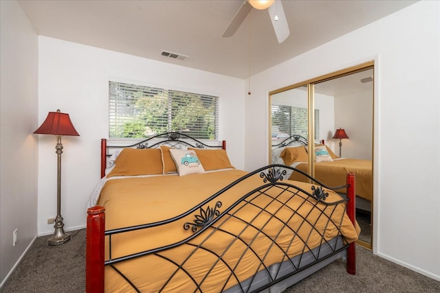 carpeted bedroom with a closet and ceiling fan