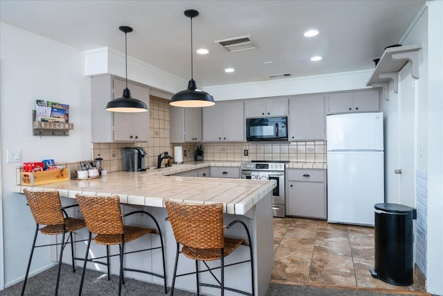 kitchen featuring gray cabinetry, electric range, sink, white refrigerator, and kitchen peninsula