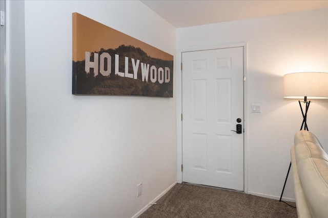 doorway to outside with carpet floors