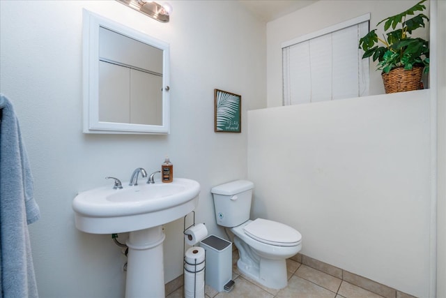 bathroom featuring tile patterned floors and toilet