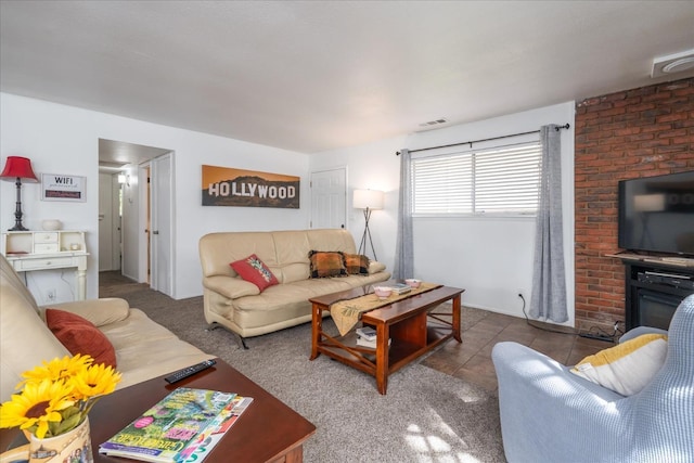 living room featuring dark tile patterned floors