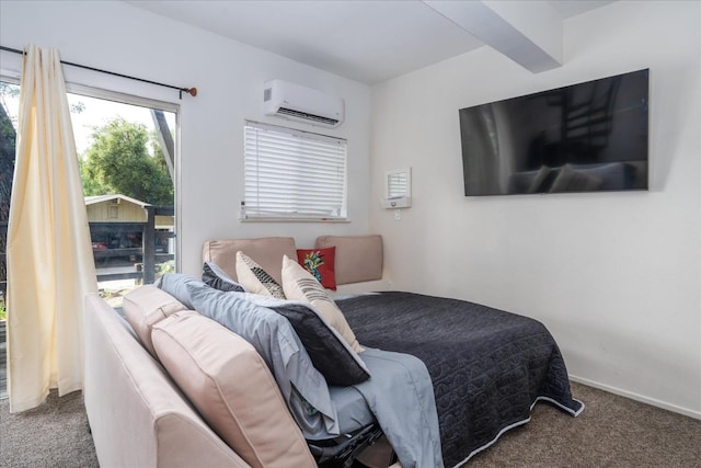 bedroom with a wall mounted air conditioner, beam ceiling, and dark colored carpet