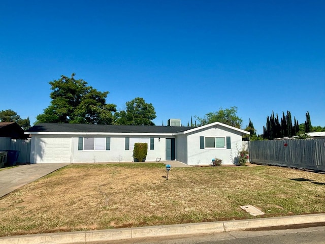 single story home featuring a front lawn and a garage