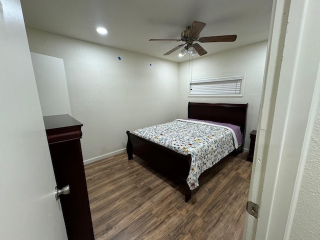 bedroom featuring ceiling fan and dark wood-type flooring