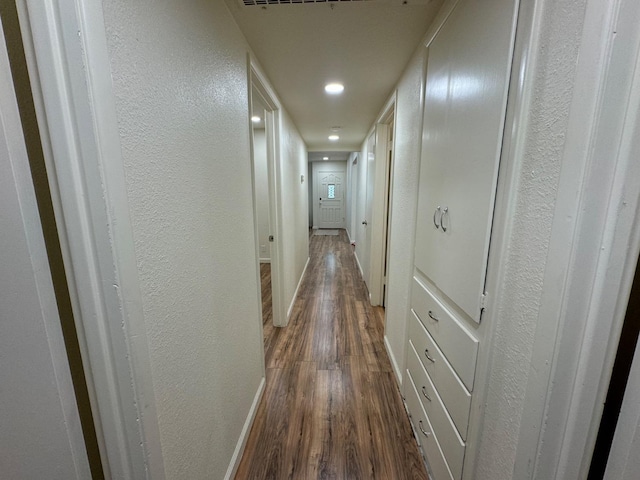 hall with dark hardwood / wood-style floors