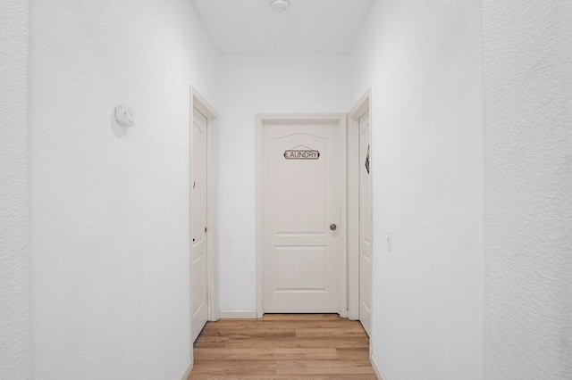 hall with light wood-type flooring