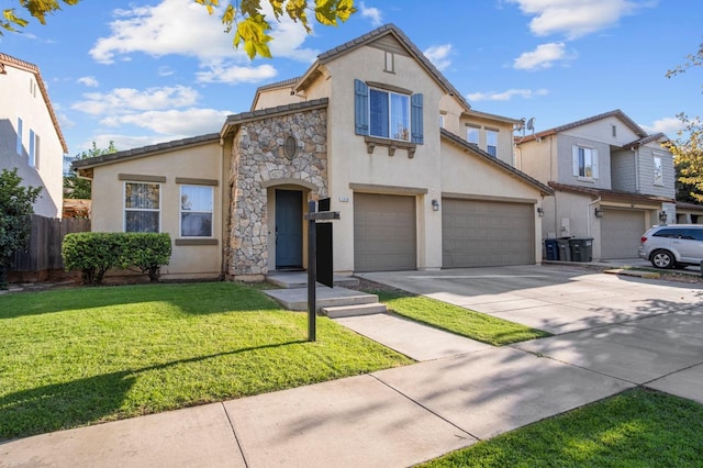 view of front of property with a garage and a front lawn