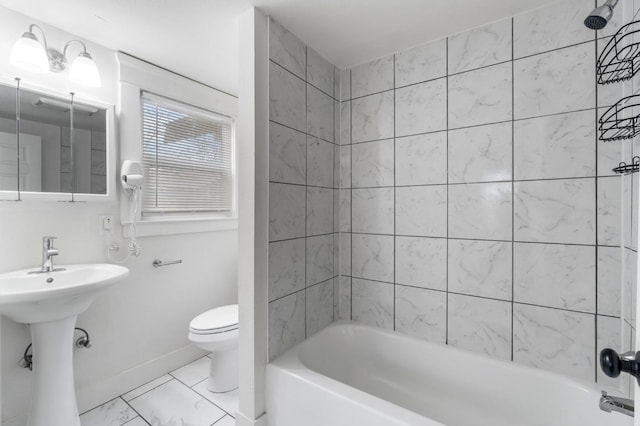 full bathroom featuring sink, shower / washtub combination, and toilet