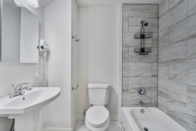 full bathroom with toilet, tiled shower / bath, and sink