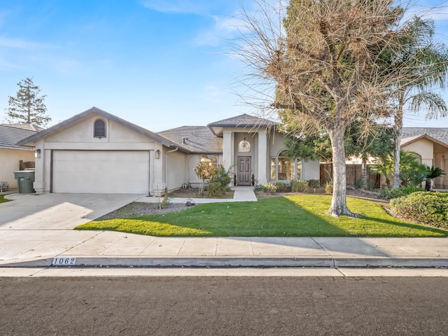 view of front of property with a garage and a front lawn