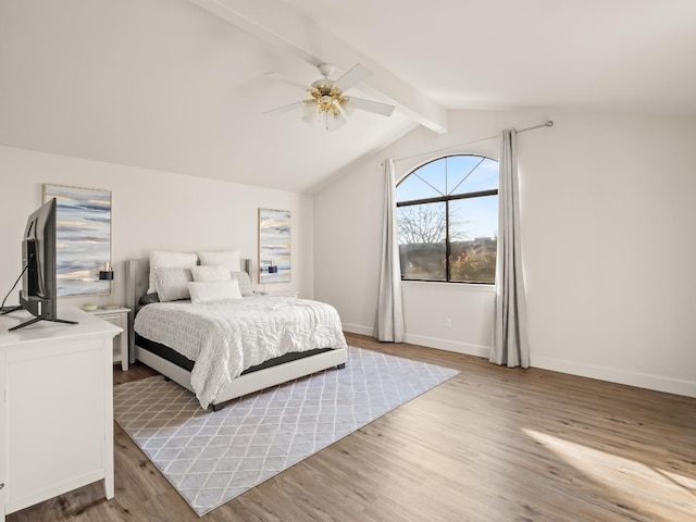 bedroom with vaulted ceiling with beams, ceiling fan, and light hardwood / wood-style floors