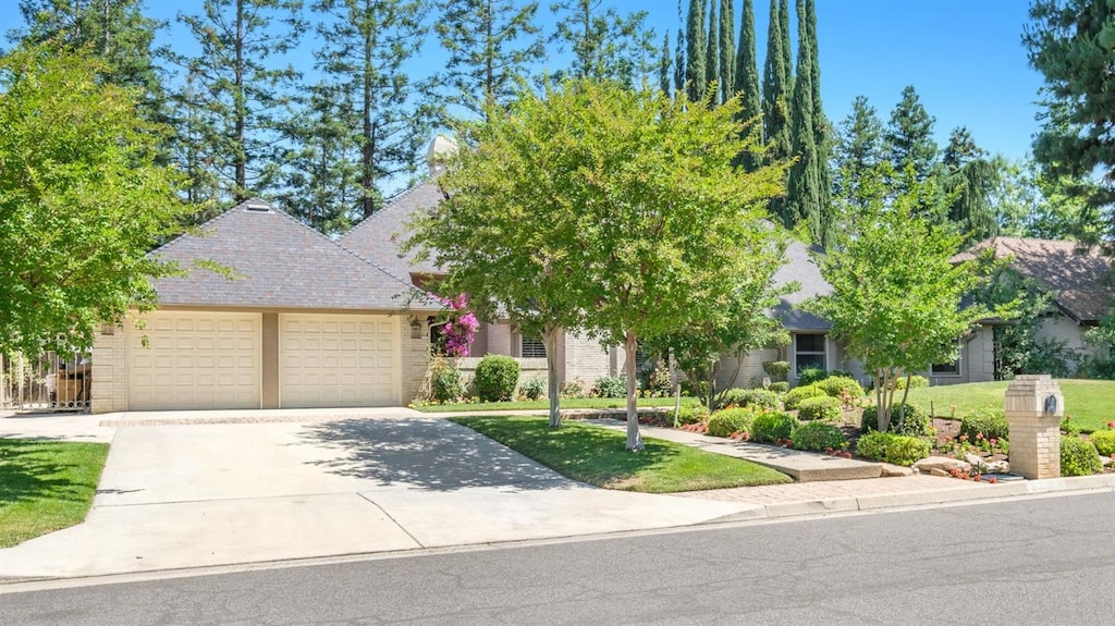 obstructed view of property with a garage