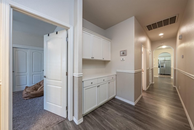 hallway featuring dark hardwood / wood-style flooring