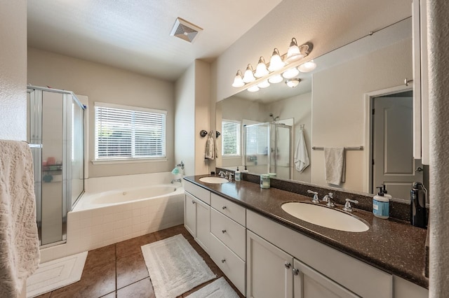 bathroom featuring tile patterned flooring, vanity, and independent shower and bath