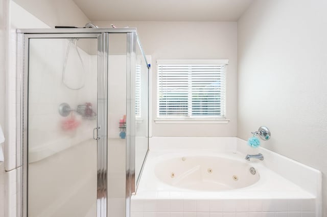 bathroom with shower with separate bathtub