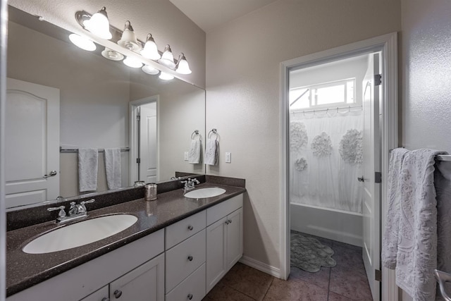 bathroom featuring tile patterned flooring, vanity, and shower / bath combo