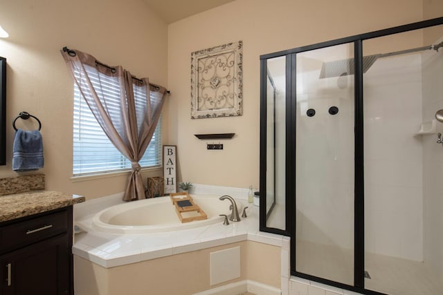 bathroom featuring vanity and plus walk in shower