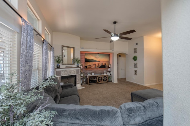 living room featuring carpet flooring and ceiling fan