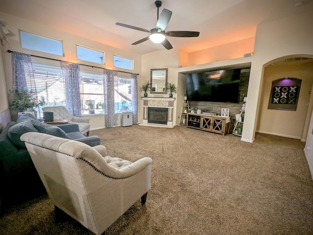 carpeted living room featuring ceiling fan