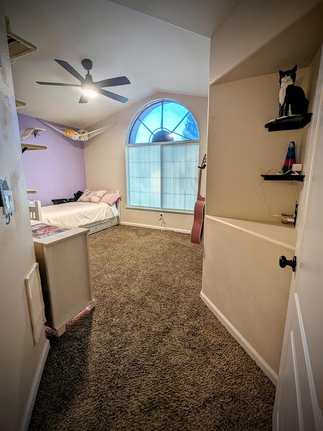 bedroom with vaulted ceiling, ceiling fan, and carpet floors