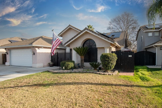 view of front of house with a garage, a front lawn, and solar panels