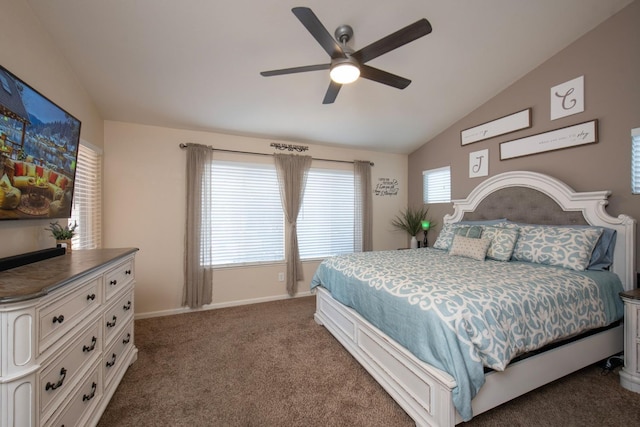 carpeted bedroom with ceiling fan and vaulted ceiling