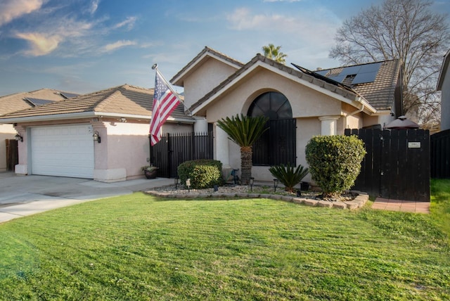 view of front of property featuring a garage, a front lawn, and solar panels