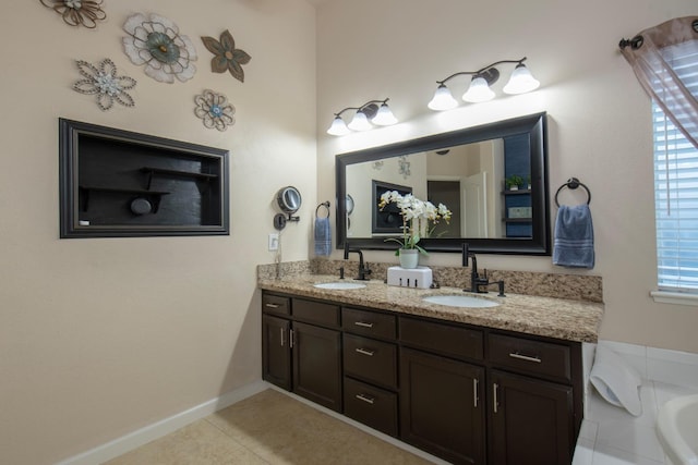 bathroom featuring vanity, a wealth of natural light, and tile patterned floors