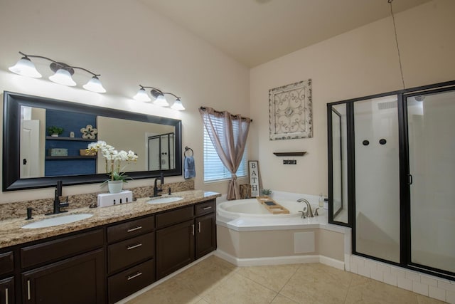 bathroom with lofted ceiling, independent shower and bath, tile patterned flooring, and vanity