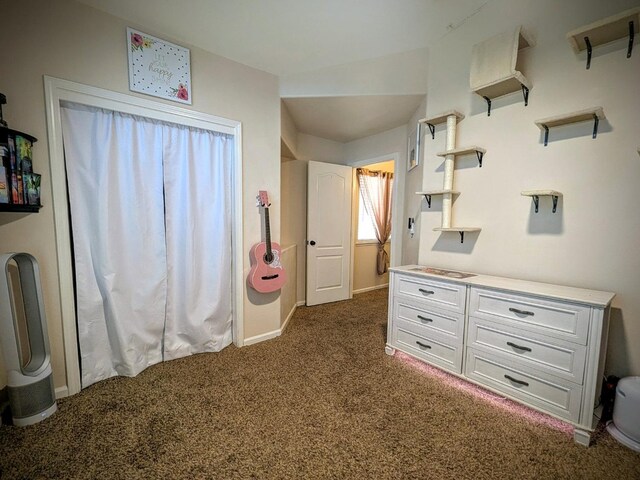 unfurnished bedroom featuring dark colored carpet