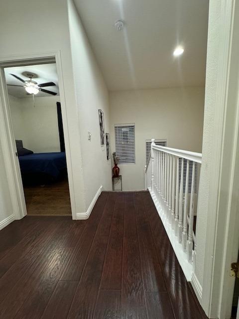 hallway featuring dark wood-type flooring